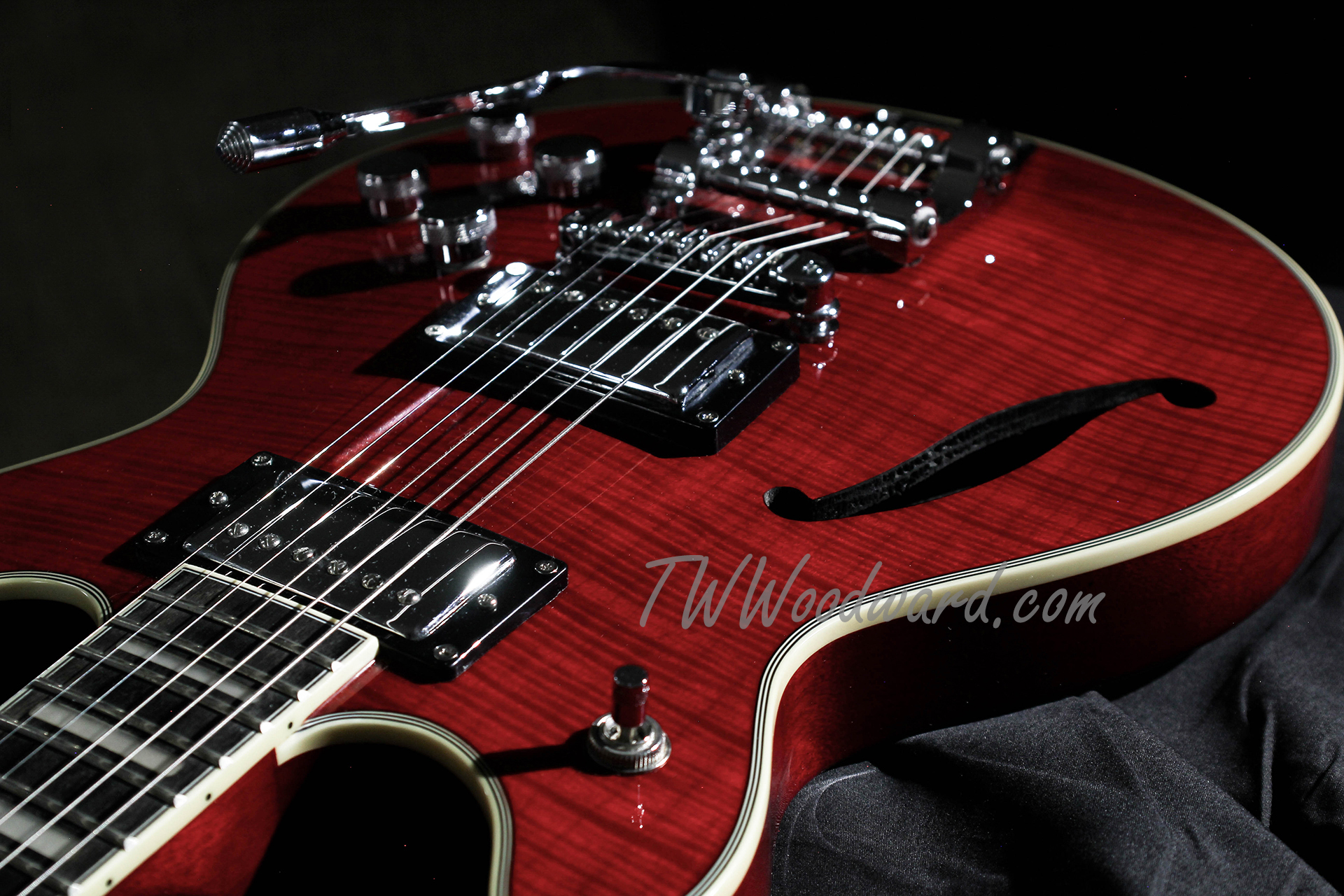 Vintage red guitar leaning on an amplifier