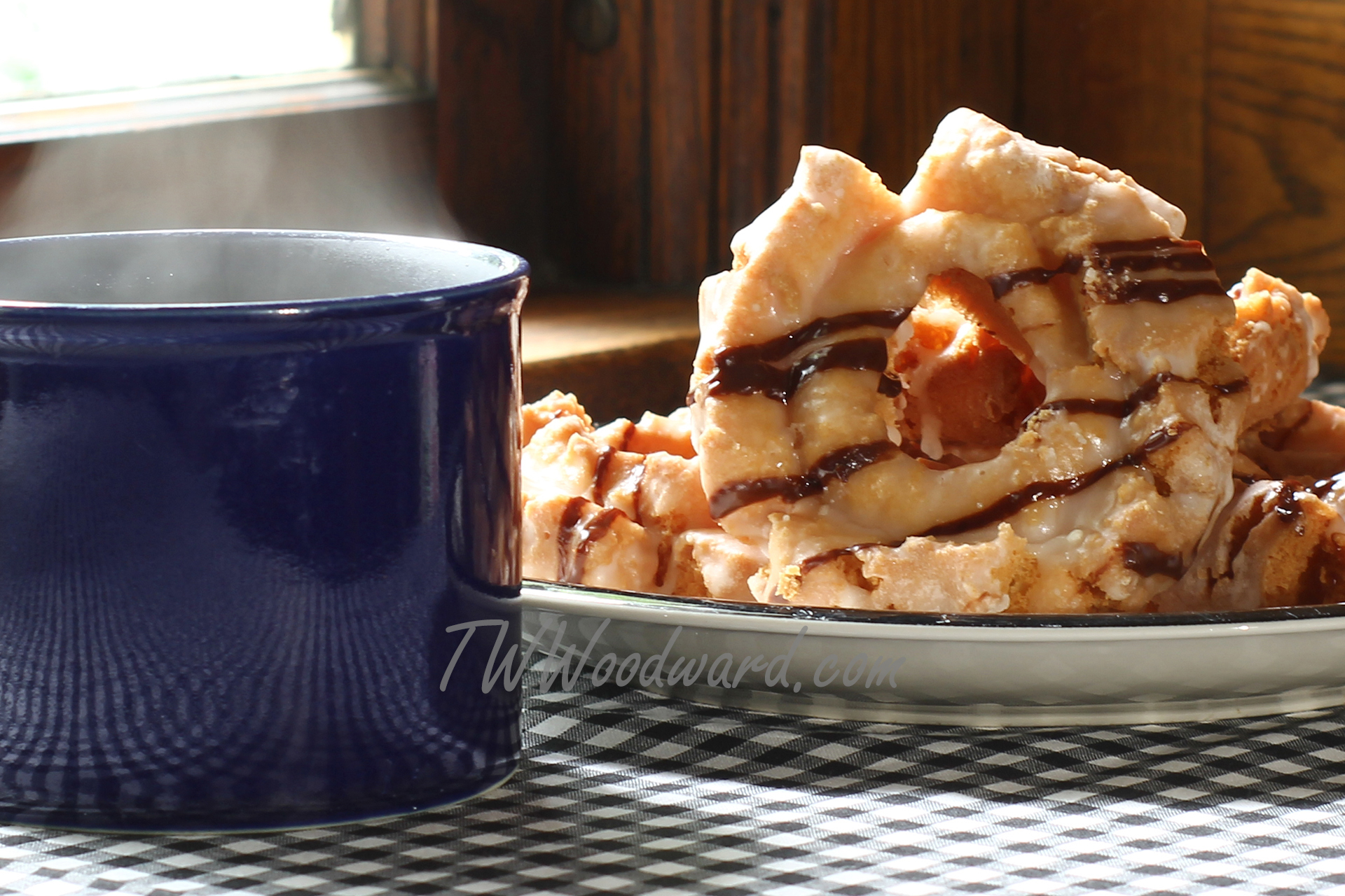 Steam rising from a city street at night